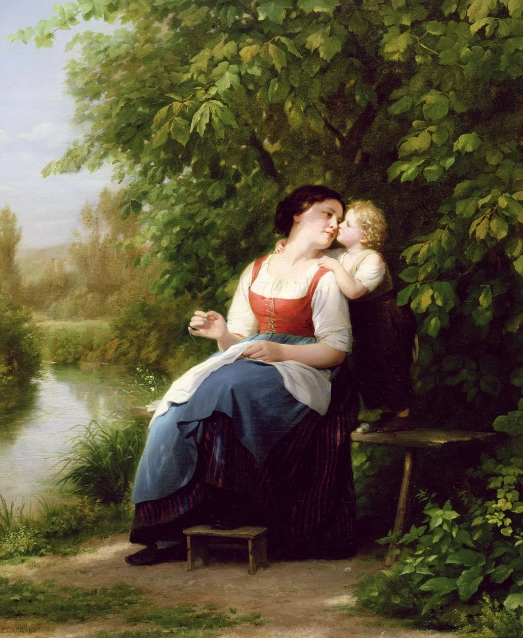 Mamma col bambino in riva al fiume